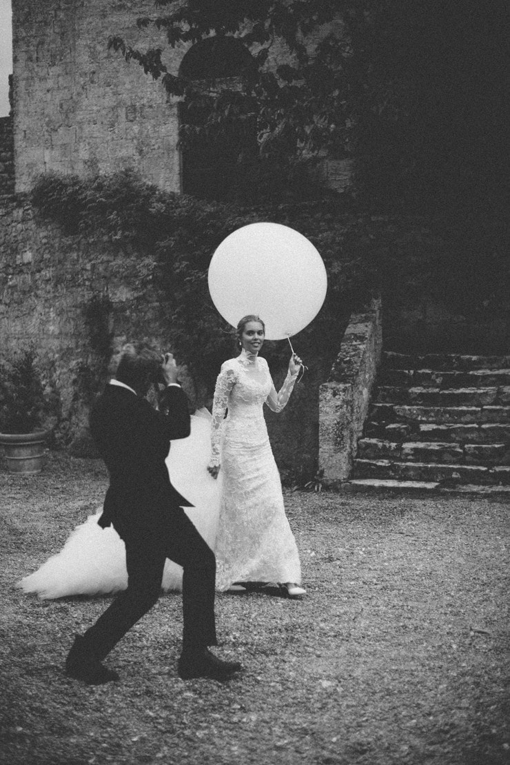 groom photographs bride in italy