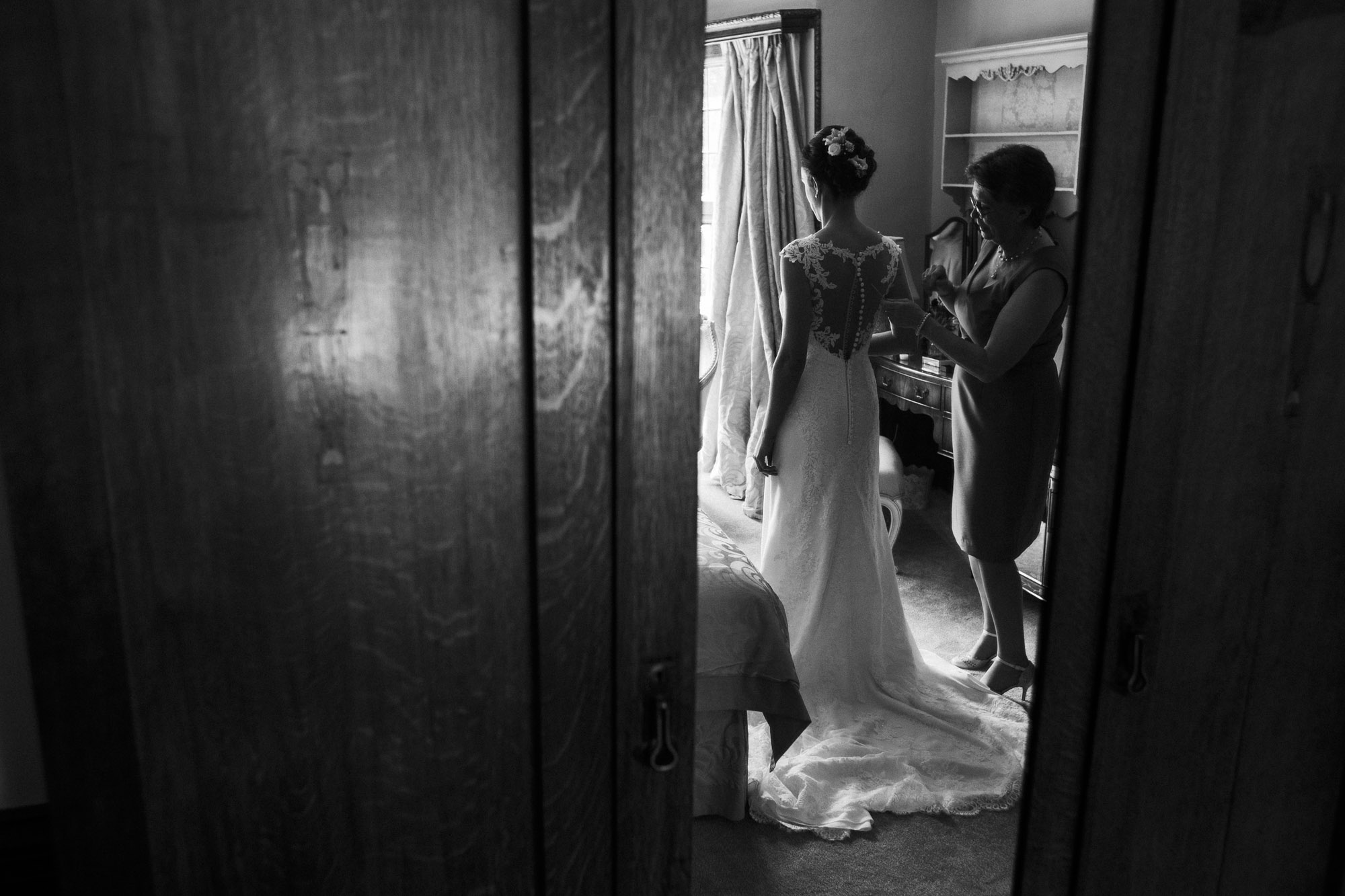 bride puts on dress