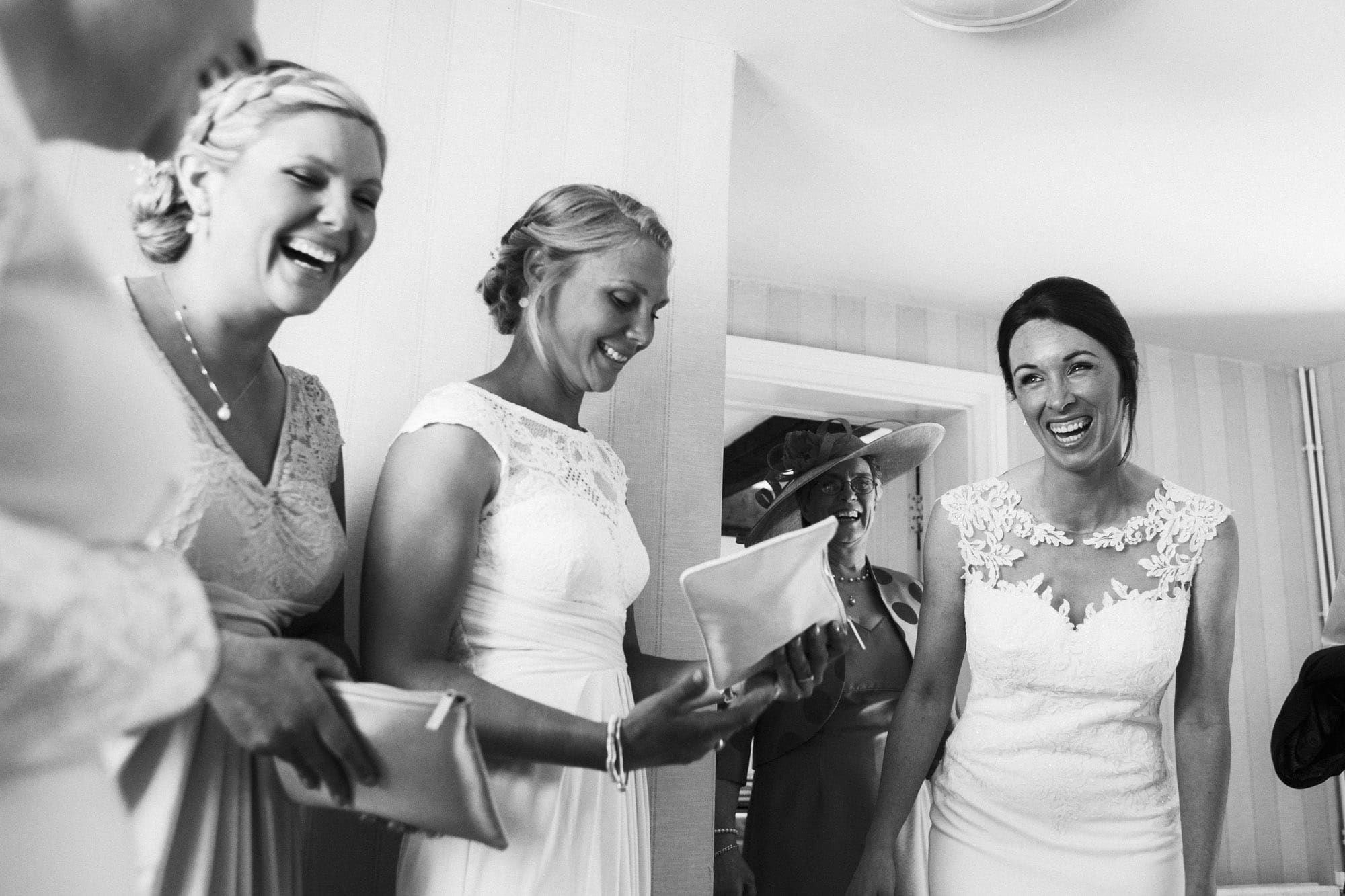 bridesmaids and bride laughing