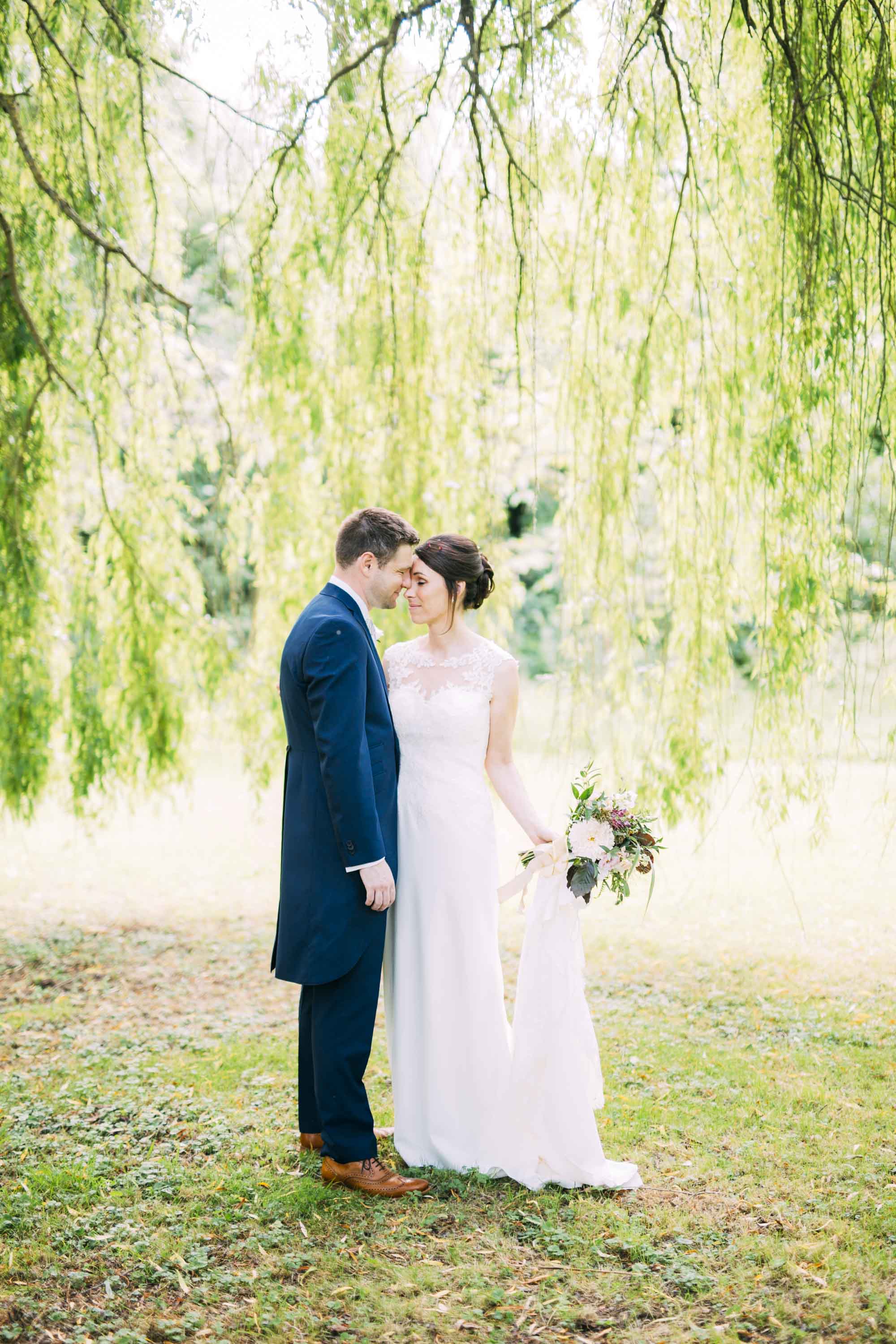 couple portrait on the south lawn at nether winchendon house wedding
