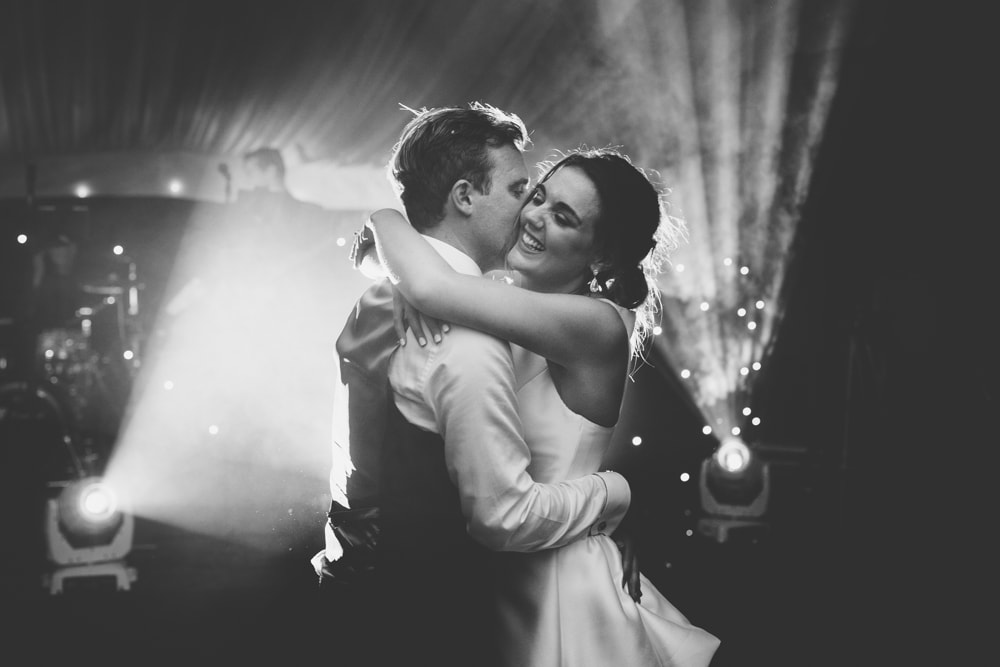 bride laughs during first dance
