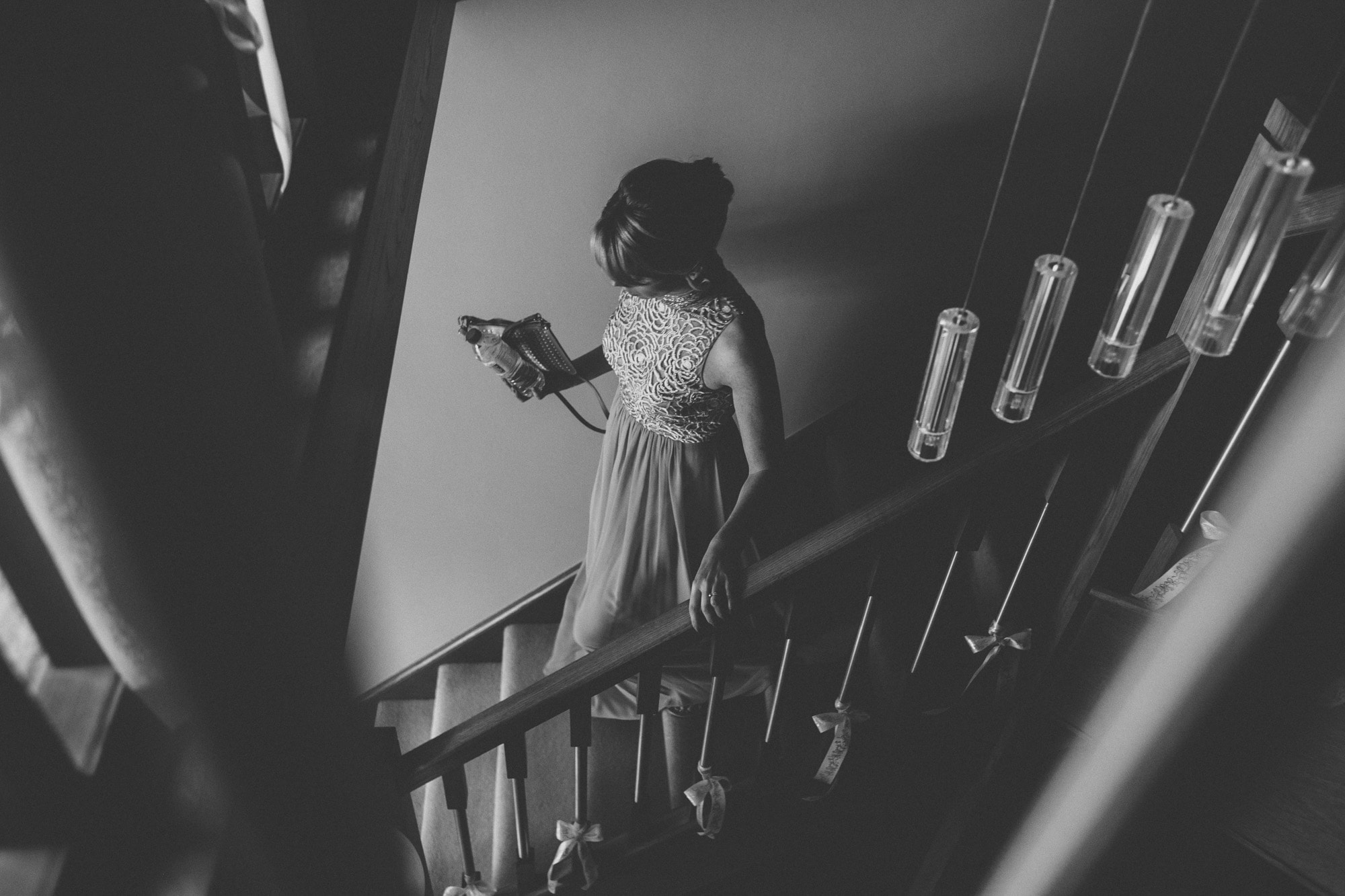 bridesmaid walks down stairs