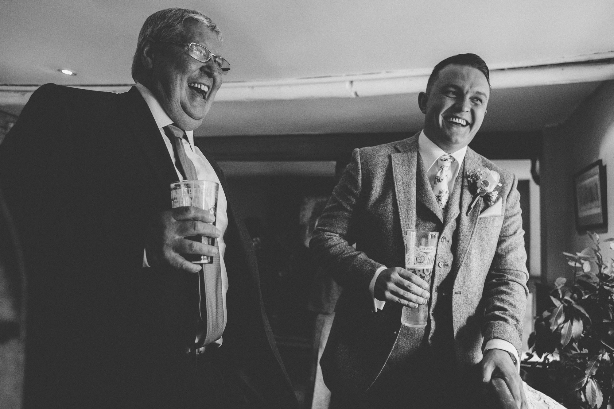 groom laughing in pub