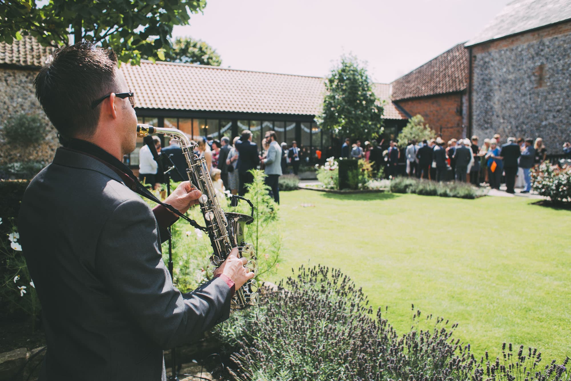 saxophonist plays at wedding