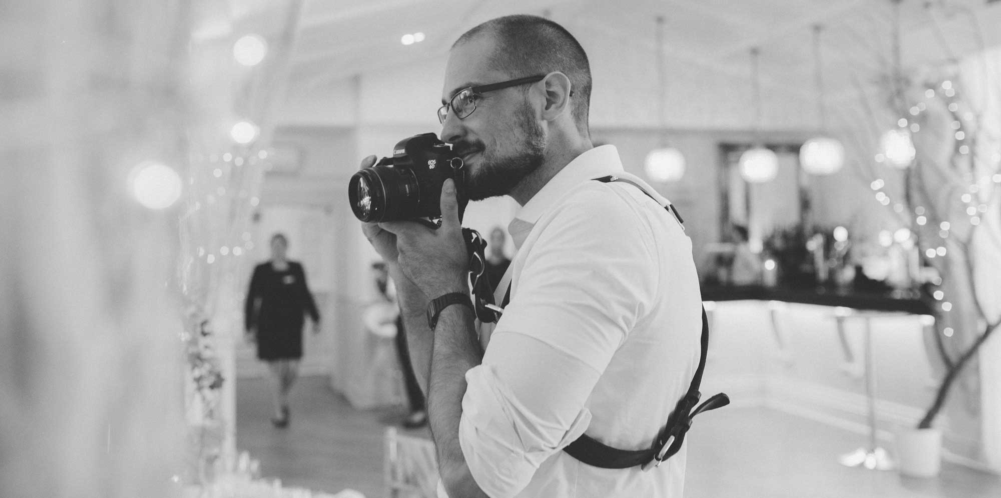 liam smith the photographer with camera on wedding day