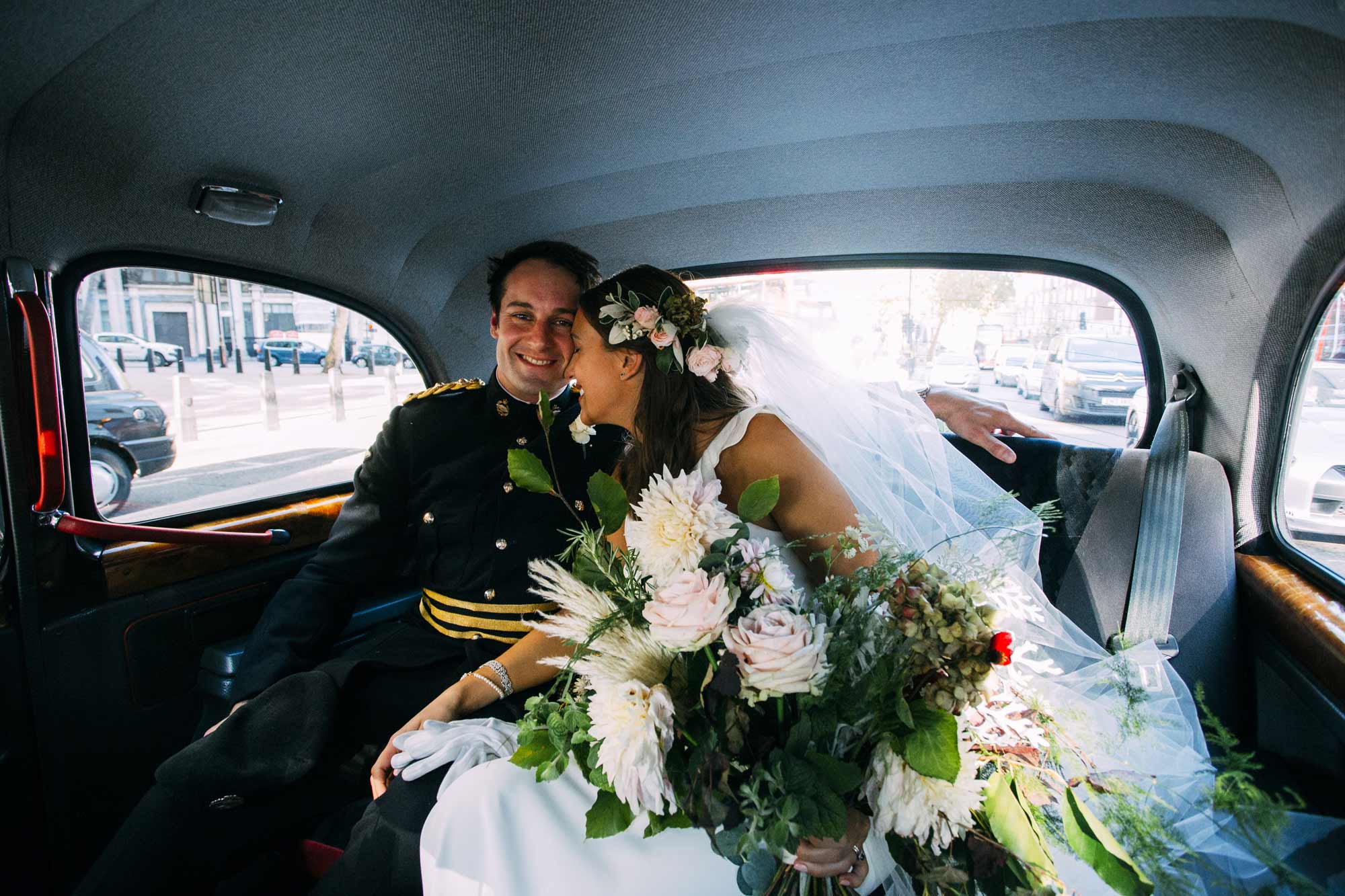married couple in black taxi