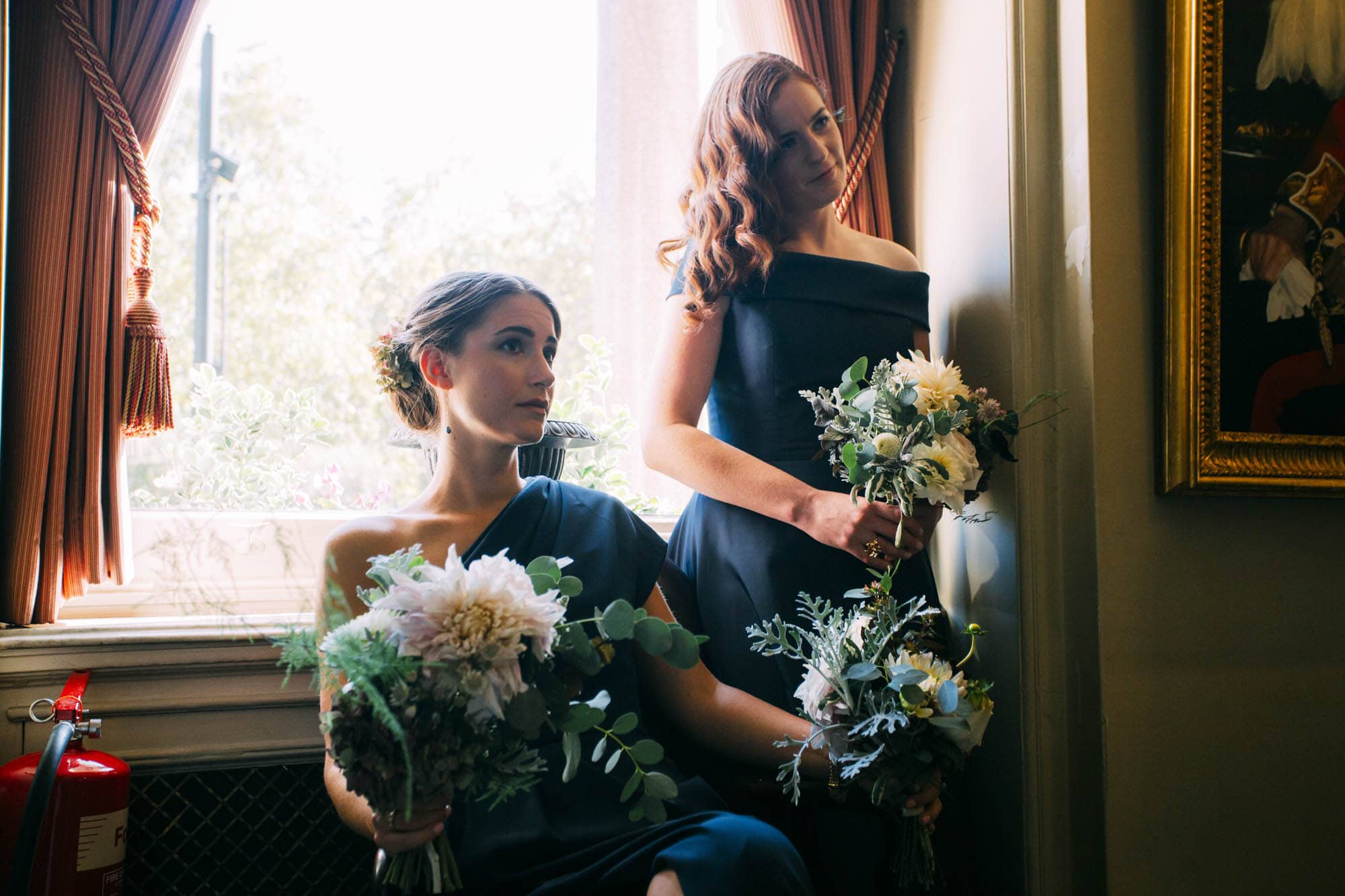 bridemaids in blue dress with beautiful flowers