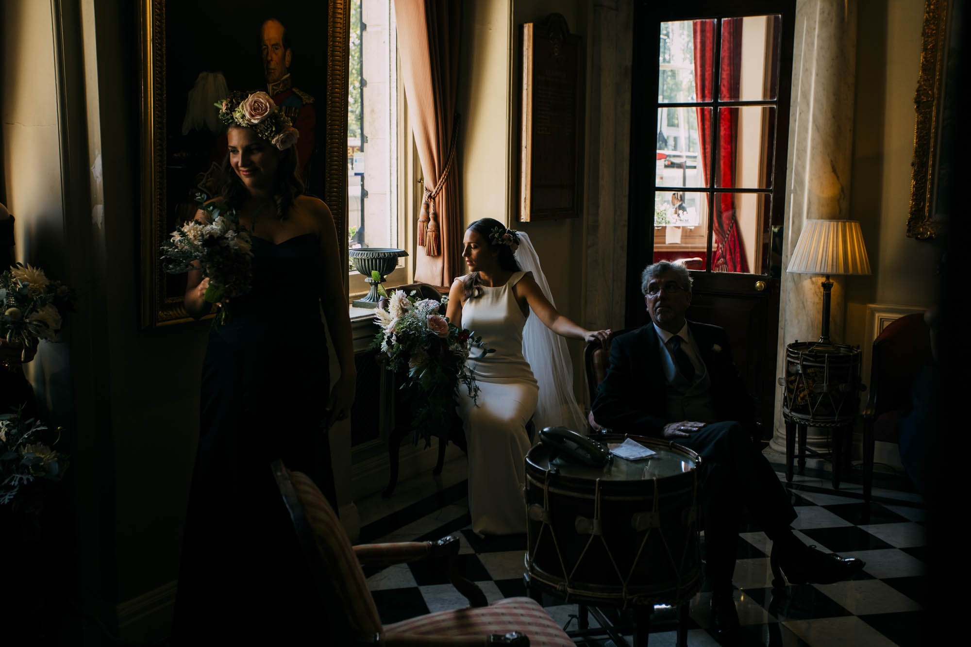 caravaggio style photograph stong contrast bride sat by window