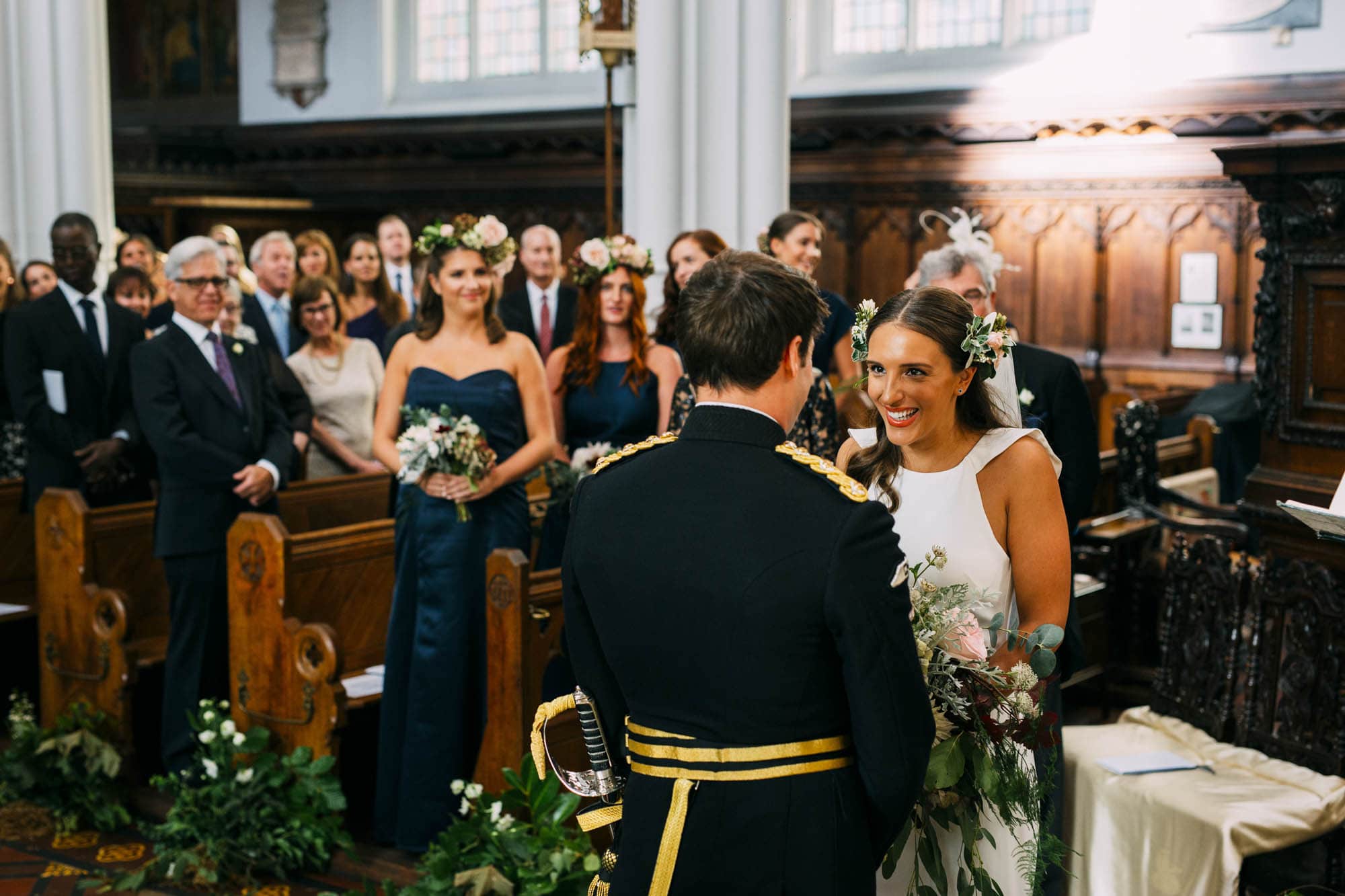 bride smiles as she meets groom in church