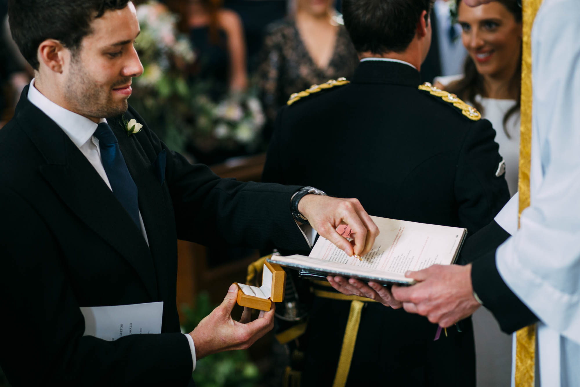 wedding rings being given to padre