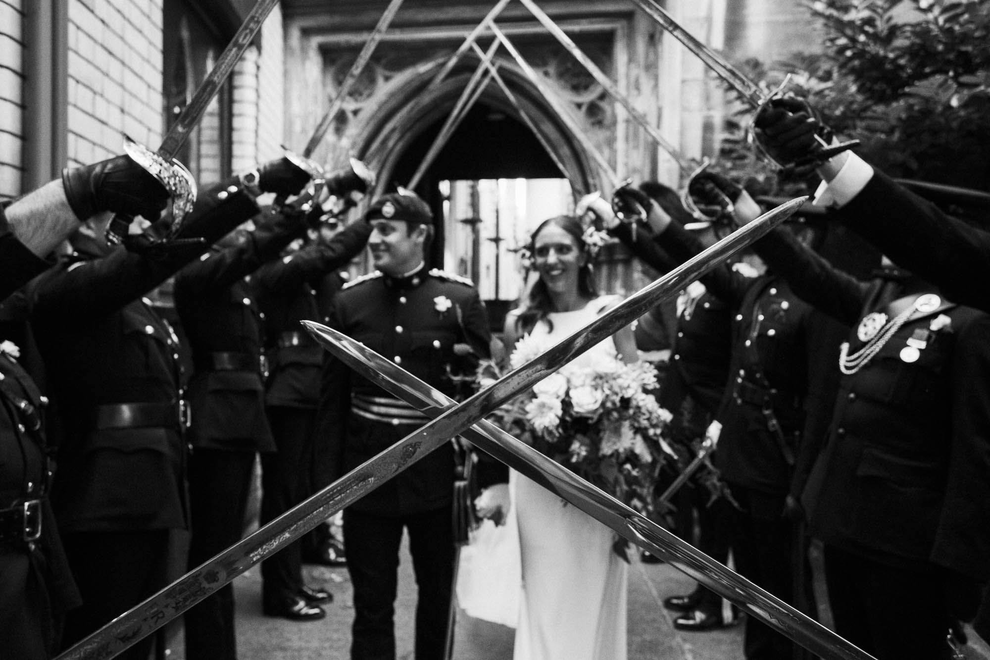 bride and groom swordarch