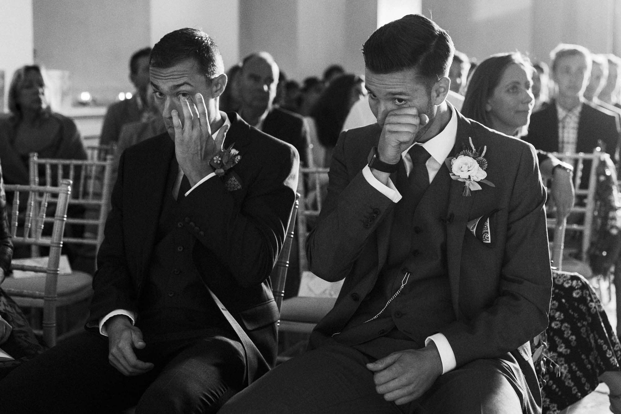 groom and brother cry before ceremony