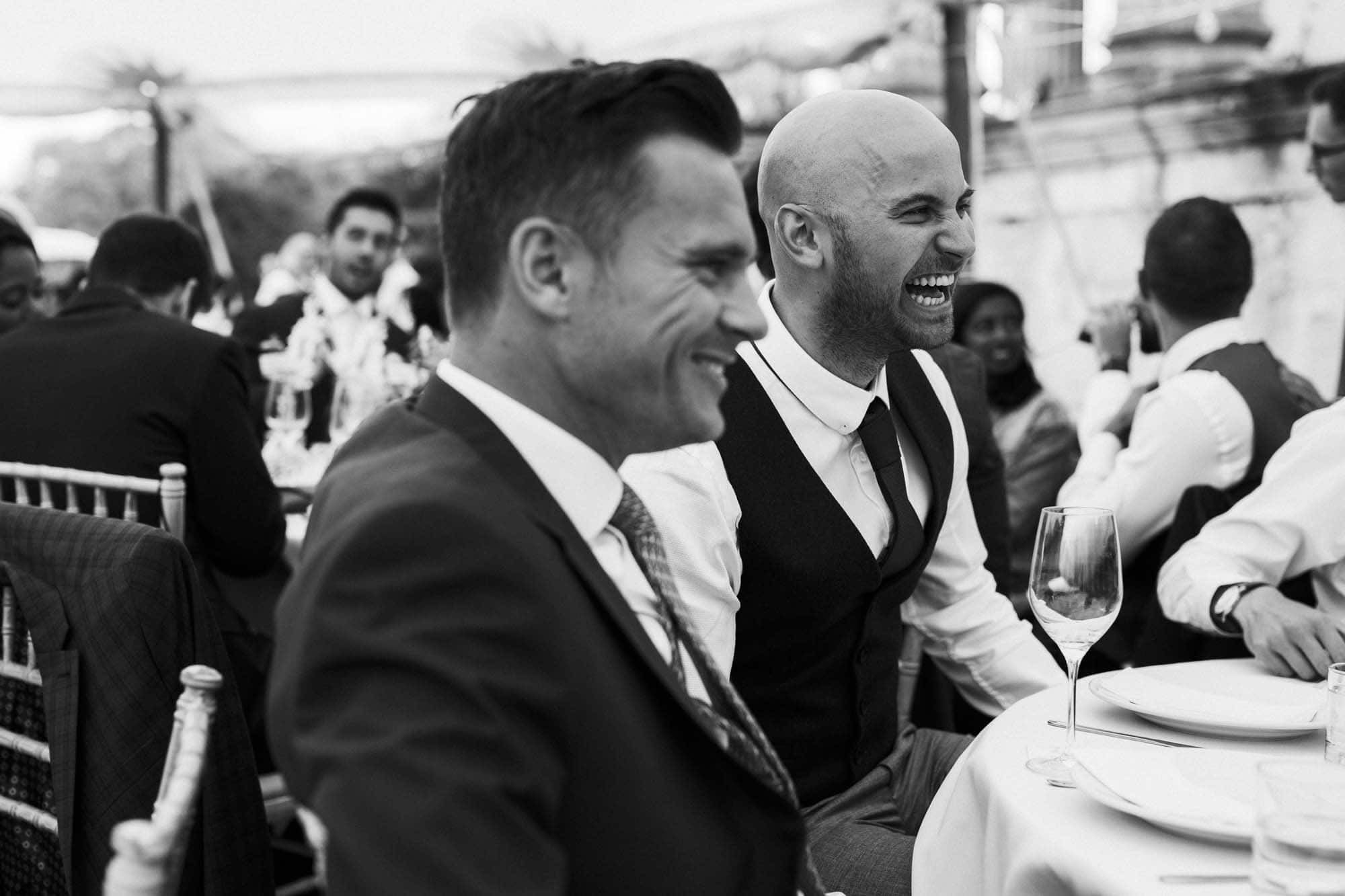 guests laugh during speeches