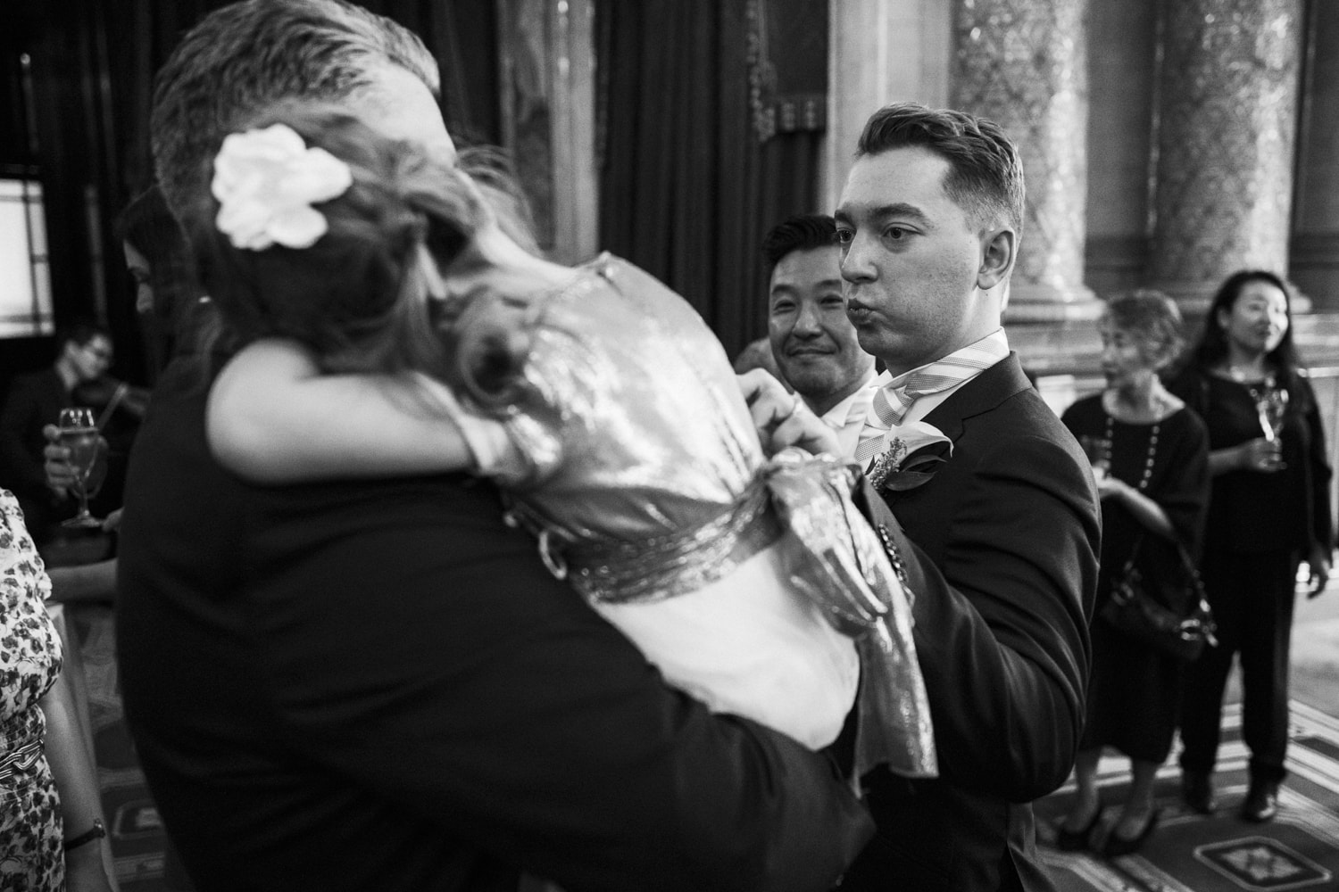 groom being affectionate with flowergirl